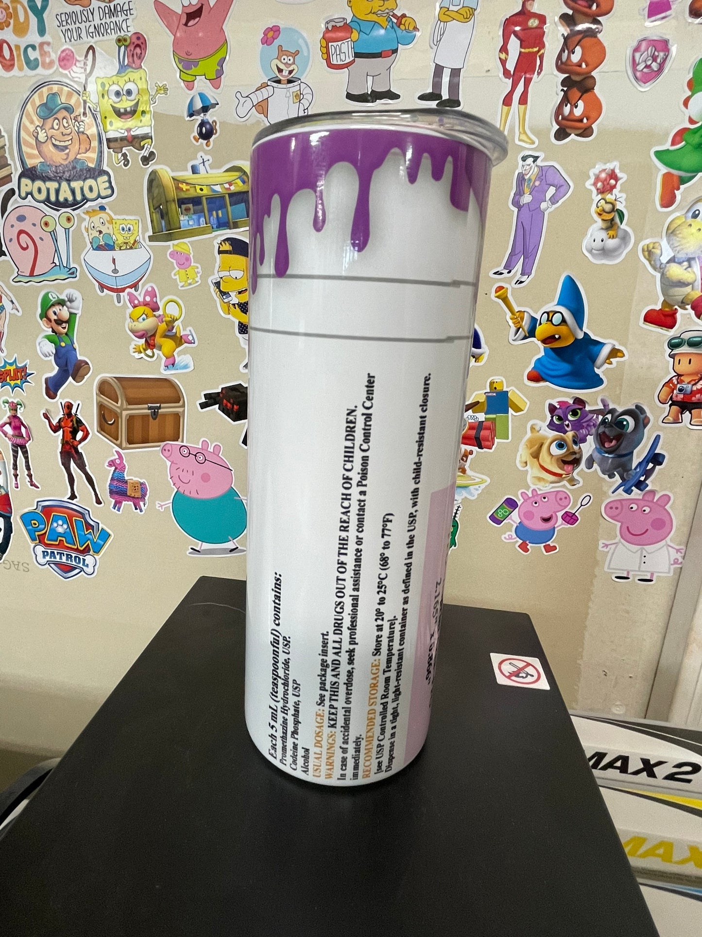 RX tumbler with purple drip.
